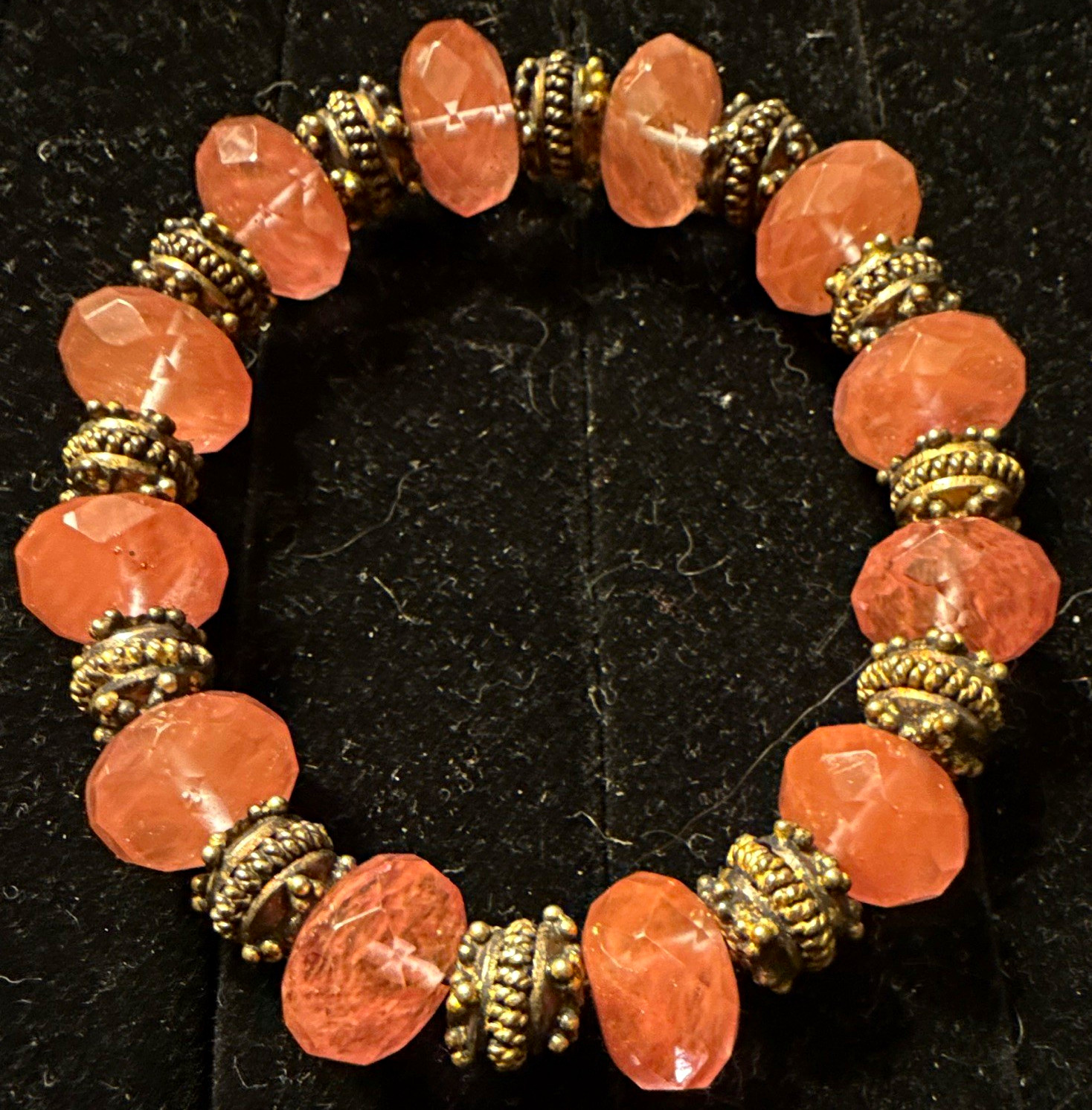 pink faceted rondelle gemstone beaded stretch bracelet, gold-tone spacers